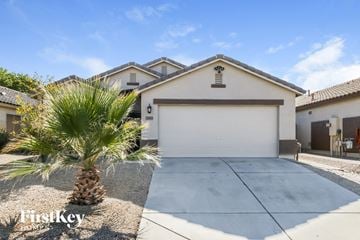 Queen Creek house for rent - a house with a garage and a palm tree in front of it