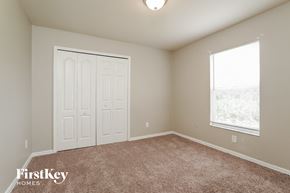 Lehigh Acres house for rent - the master bedroom has carpeted floors and a large window