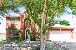 Mansfield house for rent - A red brick house with a tree in front.