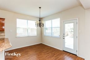 Mansfield house for rent - A room with a chandelier and a door leading outside.