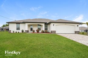 Cape Coral house for rent - a house with a lawn in front of it
