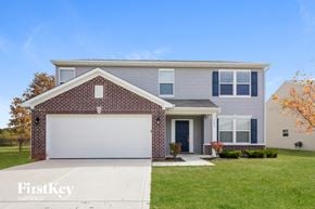 Indianapolis house for rent - a blue house with a white garage door