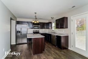 Indianapolis house for rent - a kitchen with stainless steel appliances and marble counter tops