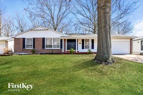 Florissant house for rent - A house with a tree in front of it.