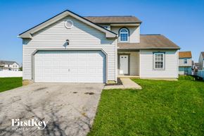 Columbus house for rent - a white house with a white garage door