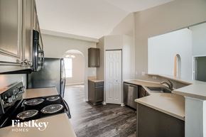 Columbus house for rent - a kitchen with a stove and a refrigerator and a sink