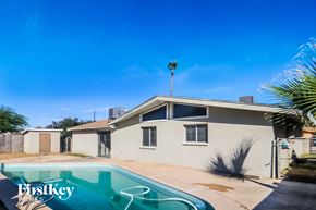 Tempe house for rent - A house with a pool in the backyard.