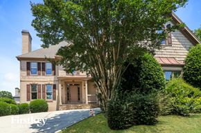 Dacula house for rent - A large house with a tree in front of it.