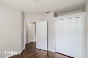 North Port house for rent - a bedroom with two closets and a door to a hallway