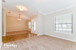 Orange Park house for rent - the living room and dining room of an empty home