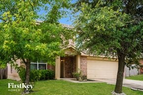 Dallas house for rent - A house with a tree in front of it.
