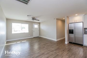 Phoenix house for rent - A spacious kitchen with wooden flooring and stainless steel appliances.