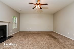Decatur house for rent - the spacious living room with fireplace and ceiling fan