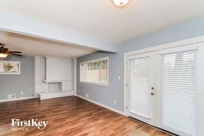 Decatur house for rent - a living room with wood floors and a door to a closet