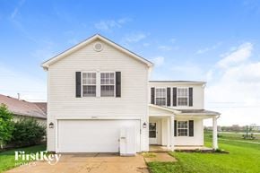 Indianapolis house for rent - A white house with a garage is for sale.