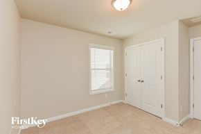 Mcdonough house for rent - a bedroom with a closet and a door and a window