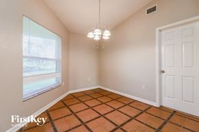 Lakeland house for rent - the living room of a home with a large window and a checkered floor