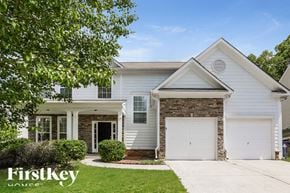 Kennesaw house for rent - A house with a white garage door is for sale.