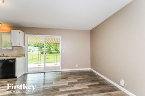 Florissant house for rent - an empty kitchen with a door to a patio