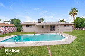 Phoenix house for rent - a backyard with a pool and a house
