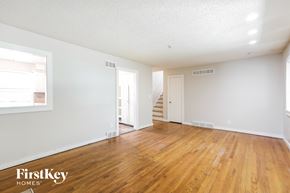 Independence house for rent - a living room with a hard wood floor and white walls