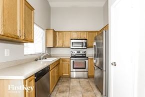 Glendale house for rent - a kitchen with wooden cabinets and stainless steel appliances
