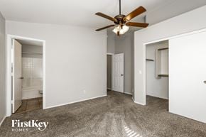 Glendale house for rent - a bedroom with white walls and a ceiling fan
