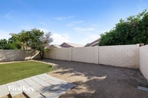 Glendale house for rent - the backyard of a house with a fence and grass