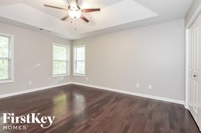 Kennesaw house for rent - A room with wooden flooring and a ceiling fan.