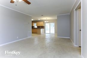 Pompano Beach house for rent - an empty living room and kitchen in a new home