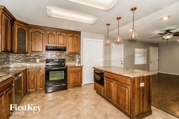 Apopka house for rent - a kitchen with wooden cabinets and a stove and a sink
