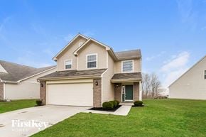 Indianapolis house for rent - A house with a garage and a front door.