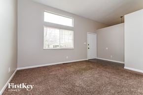 Indianapolis house for rent - A room with a carpeted floor and a window letting in light.