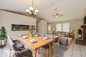 Fort Worth house for rent - A dining room with a wooden table and chairs.