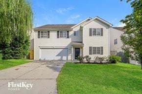 High Point house for rent - a white house with a lawn and a driveway