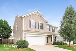 High Point house for rent - a suburban house with a white garage door