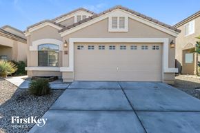 San Tan Valley house for rent - a new home with a garage door in front of it