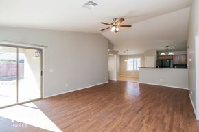 San Tan Valley house for rent - an empty living room with wood flooring and a ceiling fan