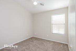 San Tan Valley house for rent - a bedroom with a carpeted floor and a window