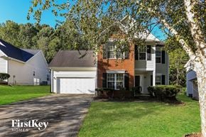Charlotte house for rent - A house with a garage is shown in the image.