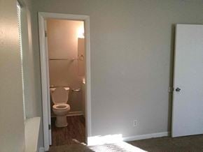 Dallas house for rent - a small bathroom with a toilet and a white door