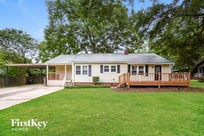 Powder Springs house for rent - a small white house with a yard and a porch