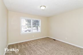 Smyrna house for rent - an empty bedroom with carpet and a window