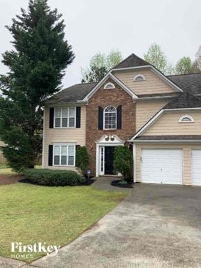 Buford house for rent - a house with a driveway in front of it
