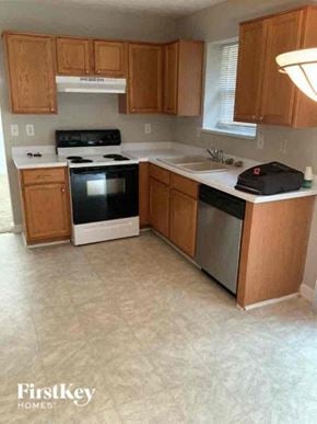 Buford house for rent - a kitchen with a stove and a sink