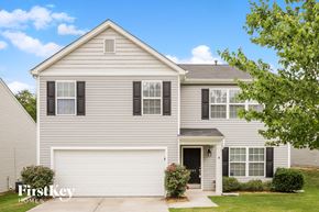 Winston-Salem house for rent - A two-story house with a garage and a driveway.