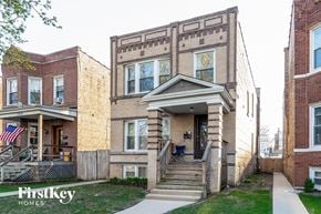 Chicago house for rent - the front of a brick house with stairs and a brick building
