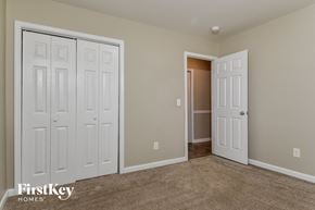 Greensboro house for rent - a bedroom with two closets and a door to a closet