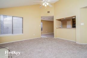 Balch Springs house for rent - A spacious room with a fan and a window.