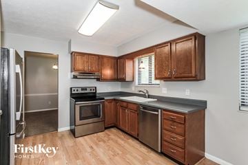 Fairfield house for rent - A kitchen with wooden cabinets and stainless steel appliances.